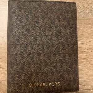 Brown Michael Kors passport holder and wallet.